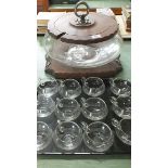 A large glass punch bowl and twelve punch glasses with wooden stand and lid (possibly Swiss)