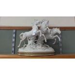 A white ceramic 'Algora' leaping horses figurine,