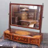 An early 19th Century mahogany toilet mirror with floral marquetry inlay to the three drawer fronts