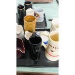 A box containing a quantity of ceramic breweriana including jugs and ashtrays