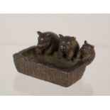 A miniature bronze of piglets,