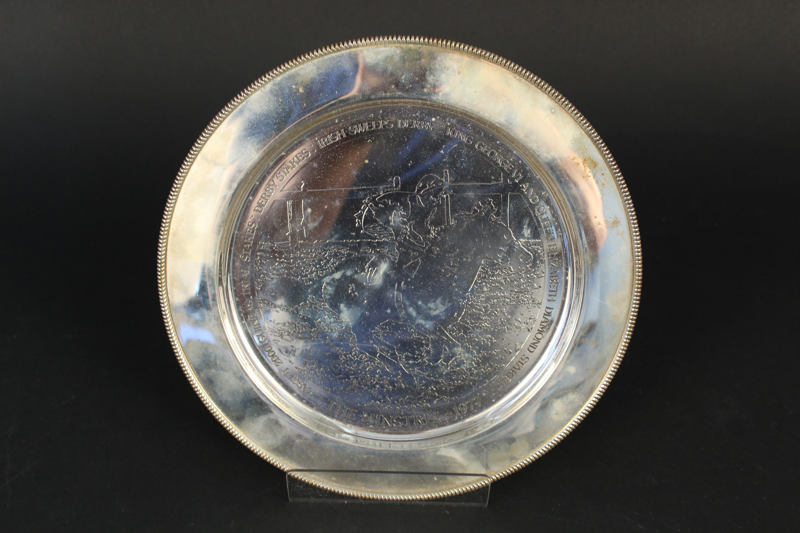 A silver plate with engraved horse racing scene entitled ''The Minstrel 1977'', in presentation box,