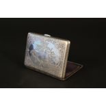 A silver card case with lined interior, engraved decoration to front and back,