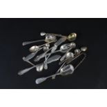 A selection of various silver cutlery including condiment spoons, butter knives, sauce ladle etc,