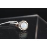 A lovely opal and diamond ring,