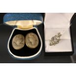 A pair of lava cameo cufflinks with white metal stone set pendant (one missing)