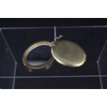 A large 18ct gold gilled oval pocket/travelling mirror with sliding action