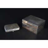 A silver cigarette box with engine turned decoration,