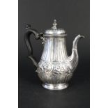 A silver coffee pot, highly decorated with flora and ribbed design, hallmarked London 1891,