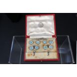 A 9ct gold cufflink and button set,