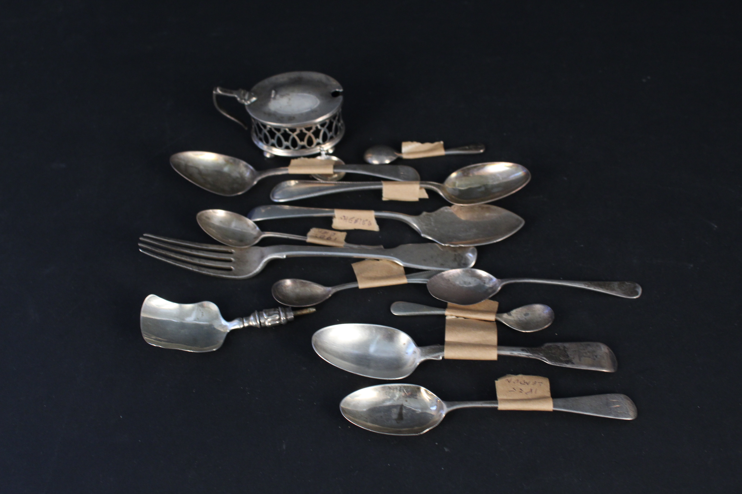 A selection of various silver cutlery (some as found) and a pierced silver mustard with blue glass