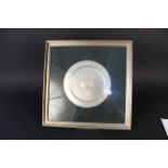 A framed silver dish with horse racing scene to centre entitled ''Grundy 1975''