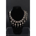 A substantial white metal choker necklace made up of twenty three brown moonstones to main section,