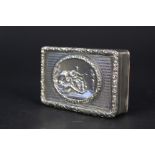 A Georgian silver table snuff box with raised foliate decoration to edge,