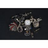 A mixed lot of silver and white metal jewellery including brooches,