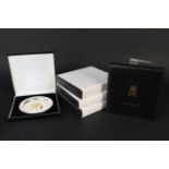 Five white metal dishes each inset with silver gilt medallion with image of Queen Elizabeth II,