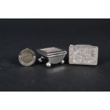 A silver stamp holder,