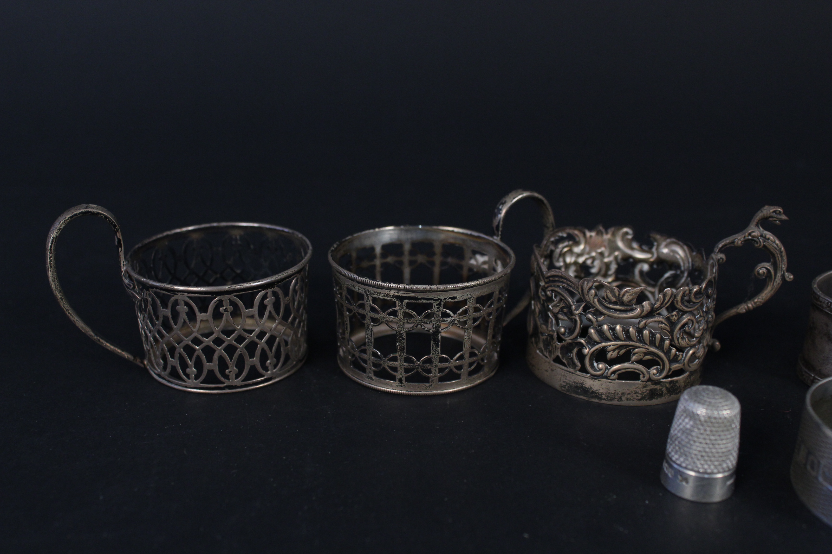 Three silver napkin rings, four silver cup holders (no glass) plus two silver thimbles, - Image 2 of 3