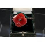 A silver enamelled poppy brooch hallmarked London by Wakely and Wheeler