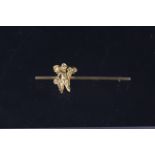 A 9ct gold bar brooch with applied cherub figure,