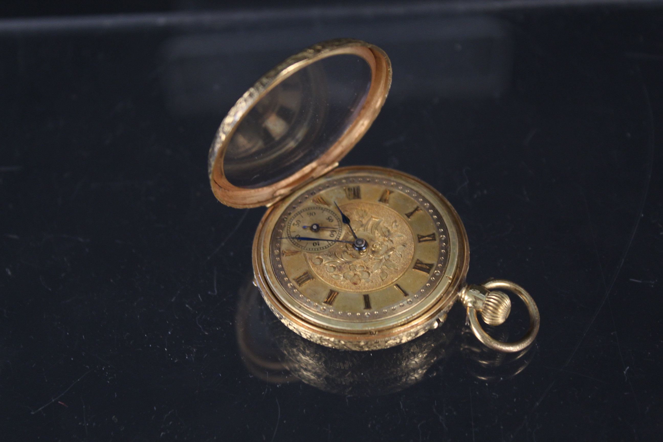 A 14ct gold continental fob watch with foliate decoration (metal dust cover) - Image 3 of 3