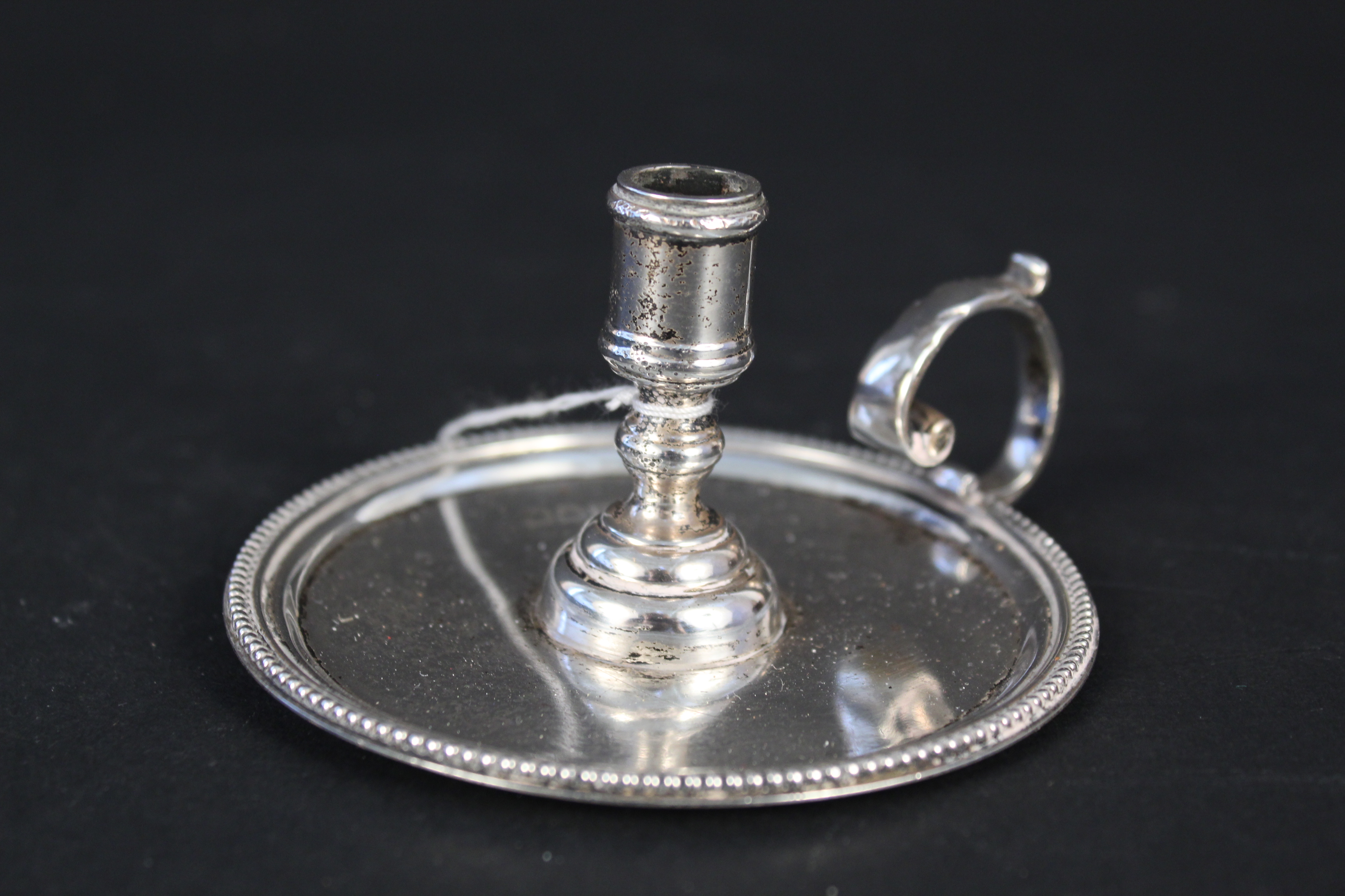 A miniature silver chamberstick with beaded edge detail, hallmarked London 1899,