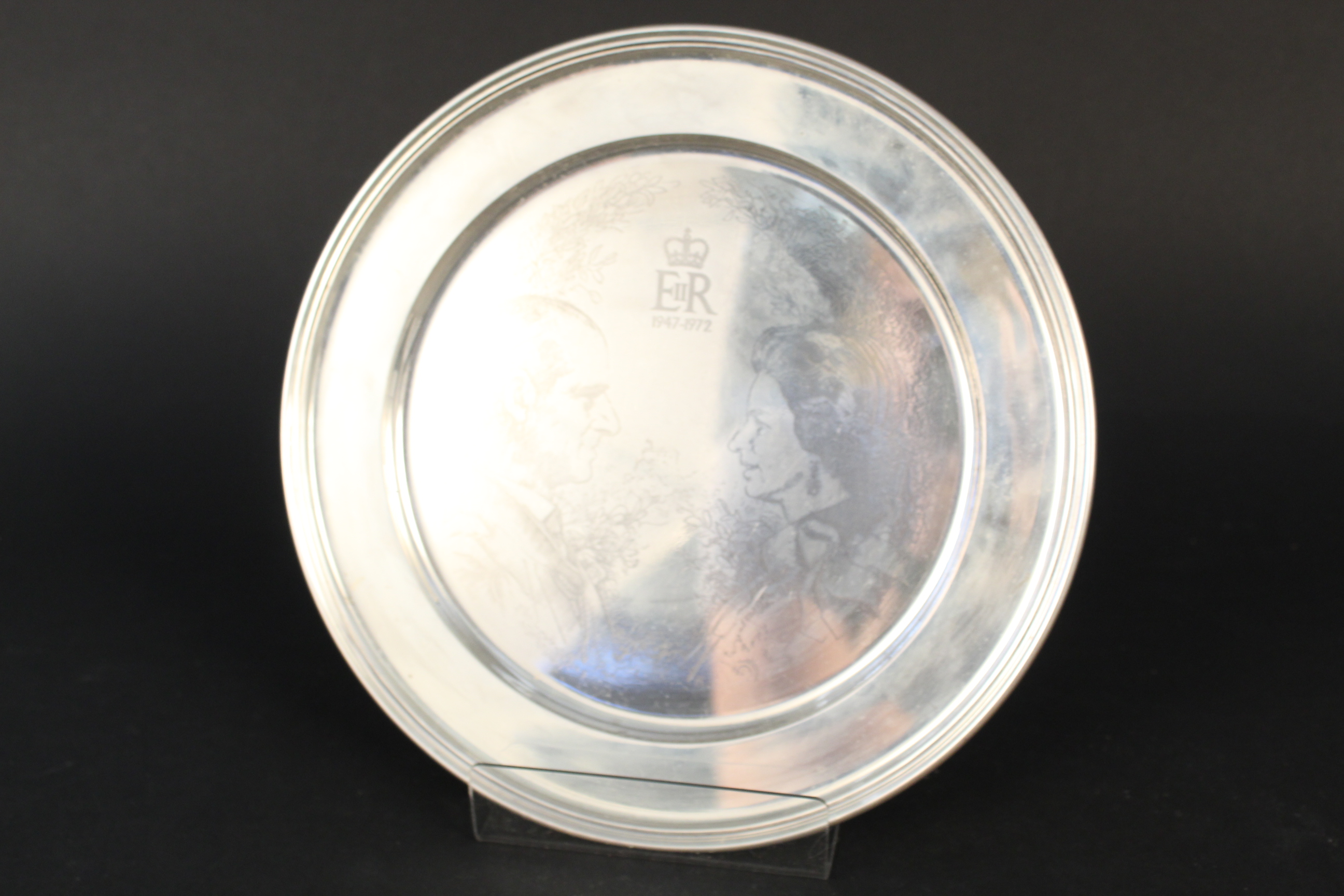 A Richard Comyns silver dish celebrating the silver wedding anniversary of Queen Elizabeth II and