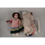 A German Heubach-Köppelsdorf 250-8/0 doll with associated outfits,