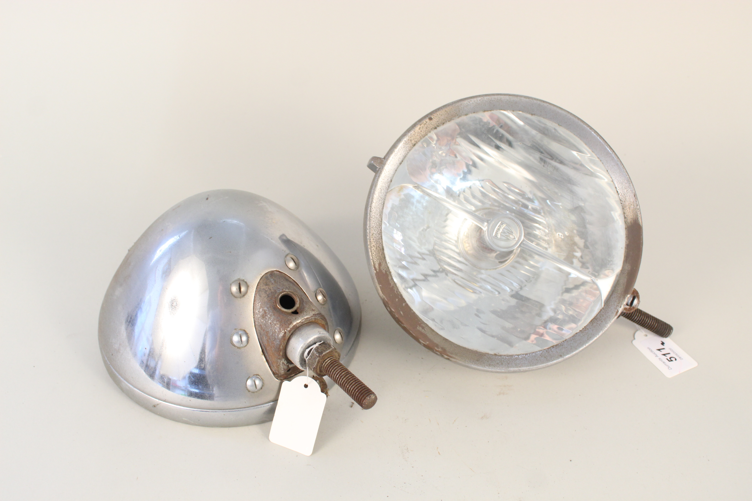 A pair of Marchal head lamps with lenses