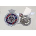 A Civil Service Motoring Association and a military police car badge
