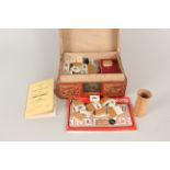 A vintage boxed Mahjong set in wooden red lacquered box with instructions