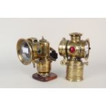 Two vintage brass bicycle lamps,