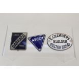 Three enamel badges including 'Darracq' and 'Ascot'