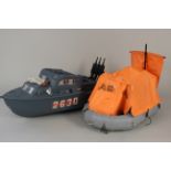 An Action Man toy raft and attack boat