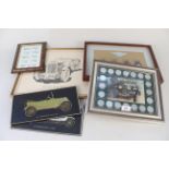 A framed display of Guy Salmon key rings, historic car coin display,
