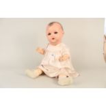 An early 20th Century Armand Marseille of German bisque headed doll with blue closing eyes and open