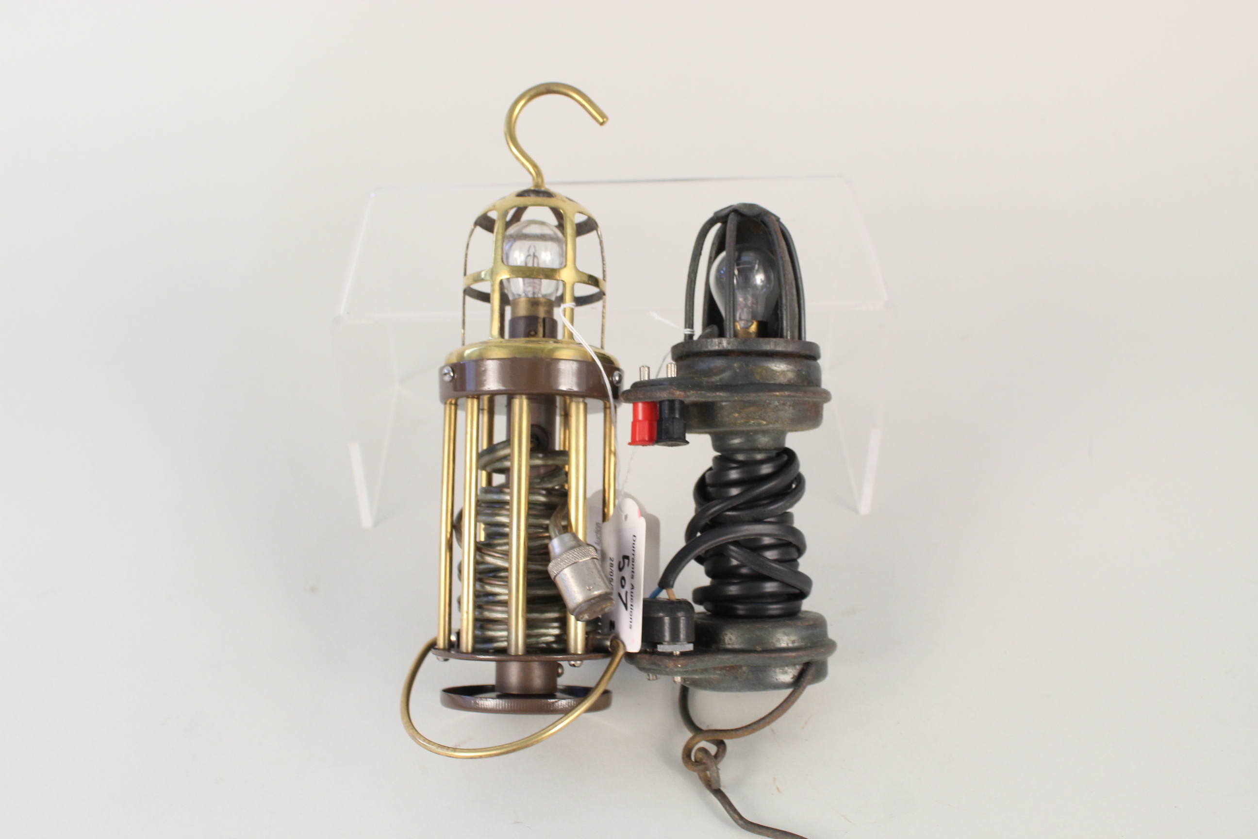 A restored brass garage lead lamp plus another