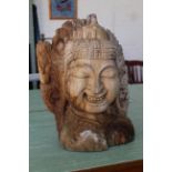 An Indonesian carved wooden head,