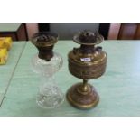 A Victorian brass oil lamp together with a cut glass example