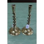 A pair of Edwardian open barleytwist brass candlesticks on circular bases 12" high