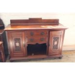 An Edwardian walnut sideboard