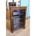 An Edwardian mahogany and inlaid glazed bookcase