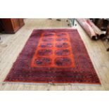 An Afghan wool rug with elephant's foot pattern 110" x 74"