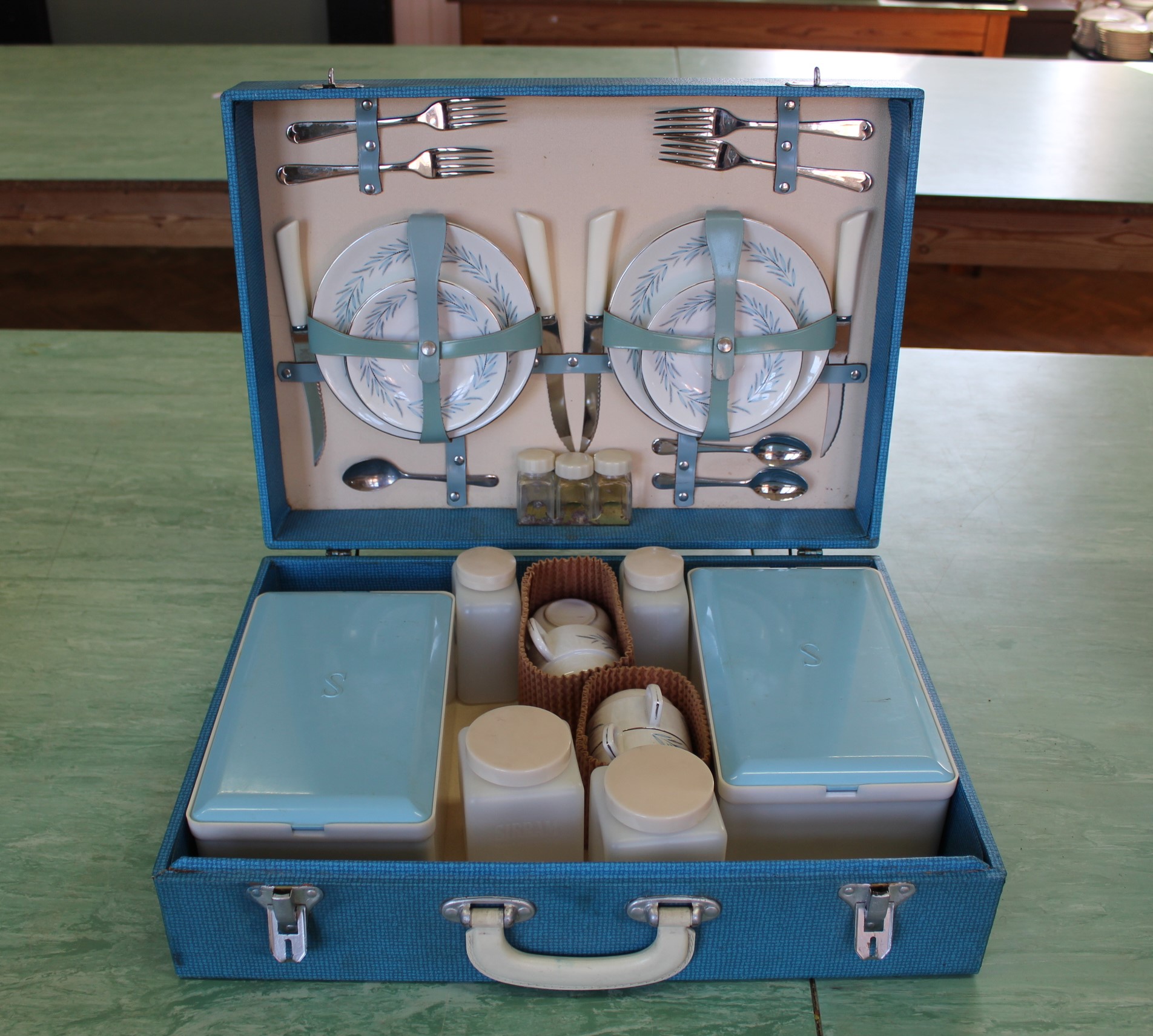 A vintage picnic set in blue hard case