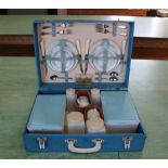 A vintage picnic set in blue hard case