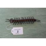 A small bronze of a centipede, articulated,