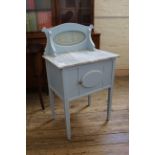 A small painted marble top washstand