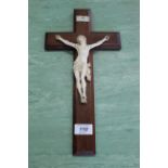 A large carved ivory figurine of Christ on the cross,