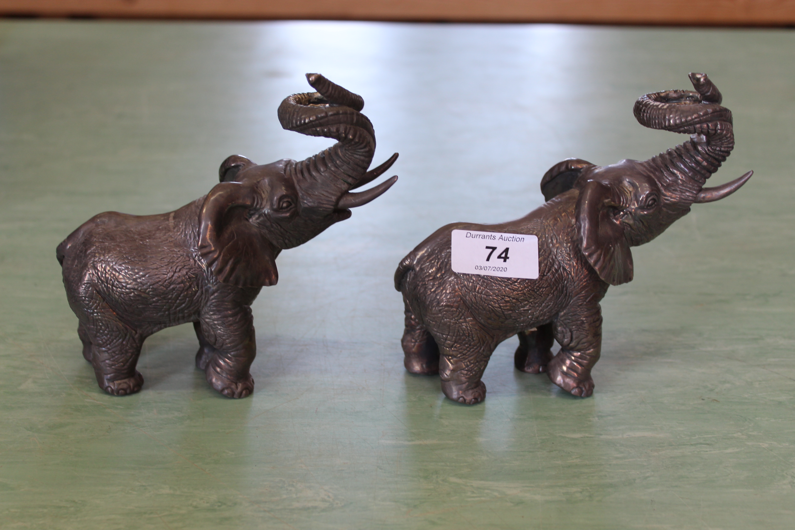 A pair of South African silver coated elephants marked 'Argent'