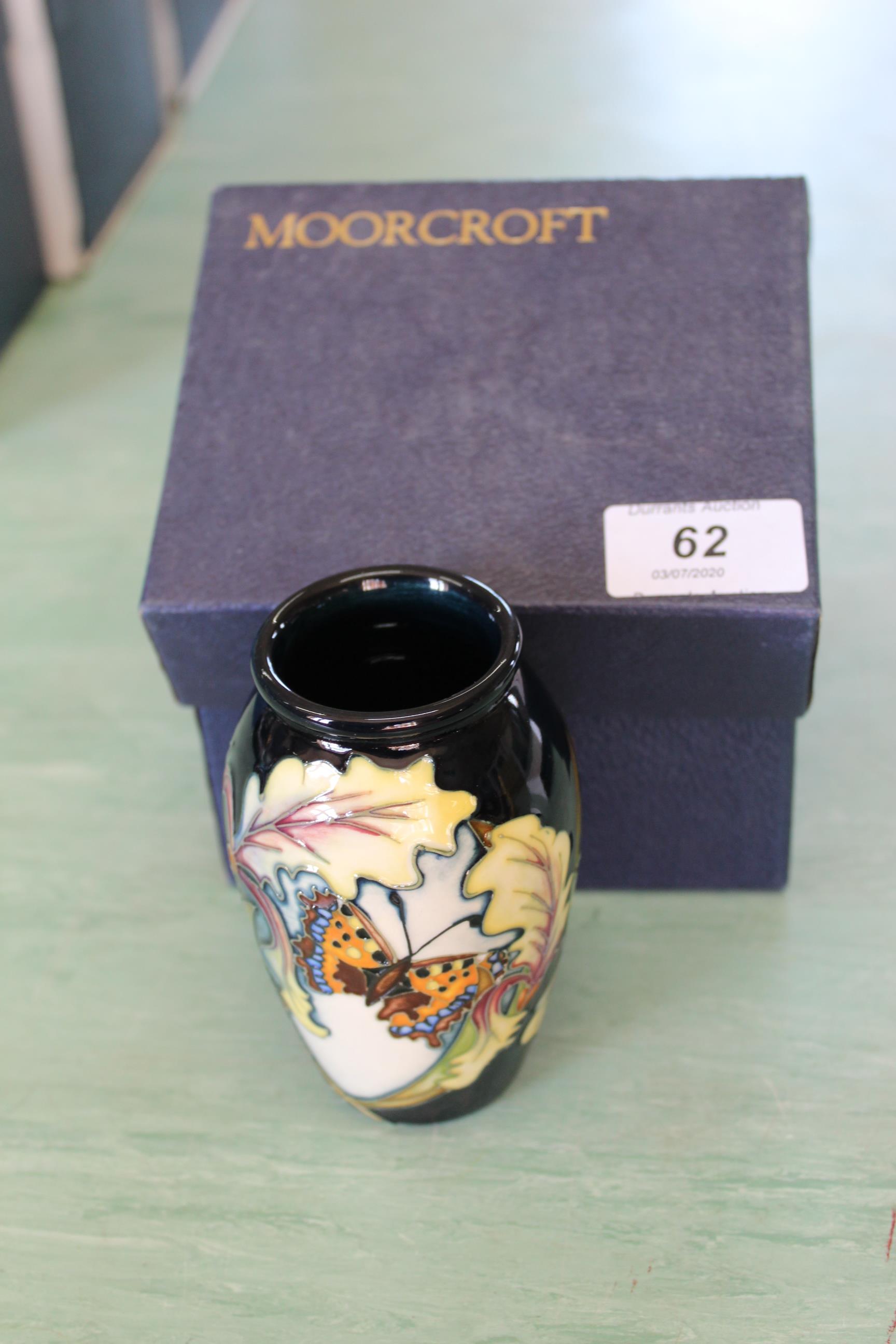 A boxed Moorcroft 'Avalon' vase,